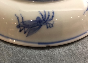 A Chinese blue and white cup and saucer with &quot;La Dame au Parasol&quot; after Pronk, ca. 1740