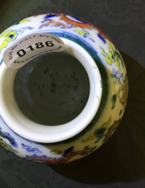 Un petit vase en porcelaine de Chine doucai &agrave; d&eacute;cor de dragons et volutes, marqu&eacute; Qianlong, 19&egrave;me