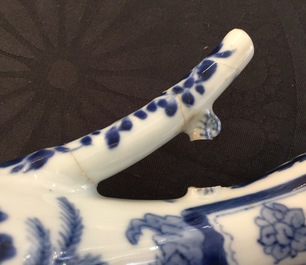 A small Chinese blue and white jug with a naked European, Kangxi