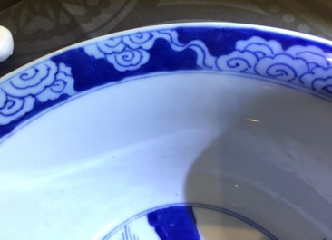 A Chinese blue and white bowl with a river scene, Kangxi