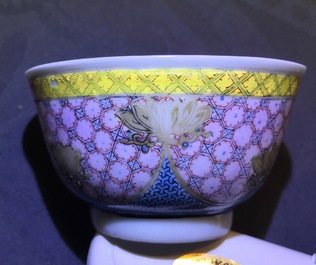 A Chinese famille rose eggshell cup and saucer with a central flowervase, Yongzheng, 1723-1735