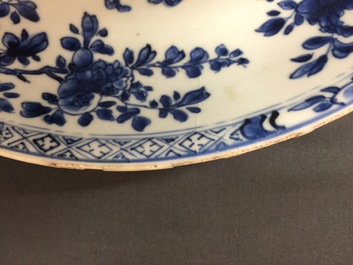 A large Chinese blue and white floral charger and two plates, Kangxi