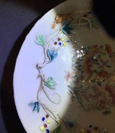 A Chinese relief-decorated famille rose cup and saucer with squirrels, Yongzheng, 1723-1735