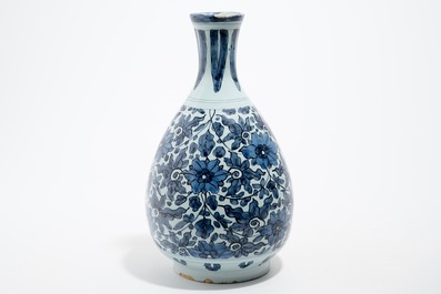 An unusual blue and white Dutch Delft chinoiserie bottle vase with lotus scroll design, late 17th C.