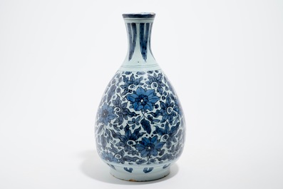 An unusual blue and white Dutch Delft chinoiserie bottle vase with lotus scroll design, late 17th C.