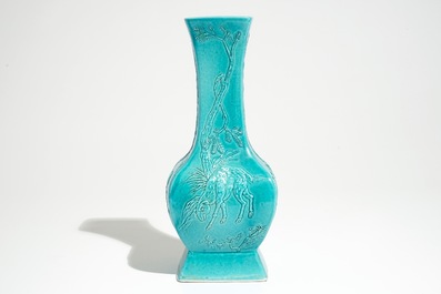 A Chinese turquoise glazed fanghu vase with applied slip design of animals, 19/20th C.