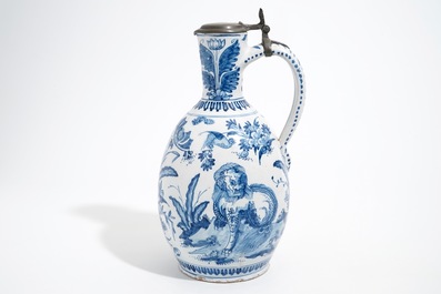 A large Dutch Delft blue and white jug with a tiger and a lion, 17th C.