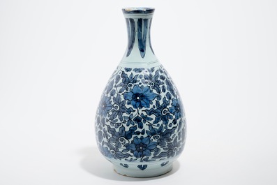 An unusual blue and white Dutch Delft chinoiserie bottle vase with lotus scroll design, late 17th C.