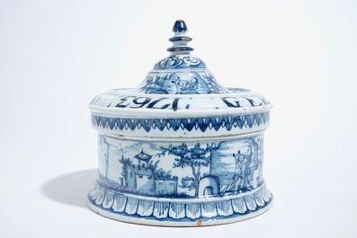 A Dutch Delft blue and white tobacco box and cover with tamper, dated 1763