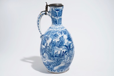 A huge blue and white Dutch Delft chinoiserie jug with an Antwerp pewter lid, 17th C.