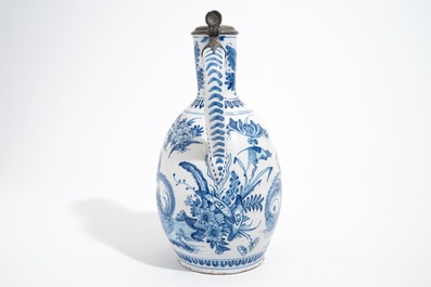 A large Dutch Delft blue and white jug with a tiger and a lion, 17th C.