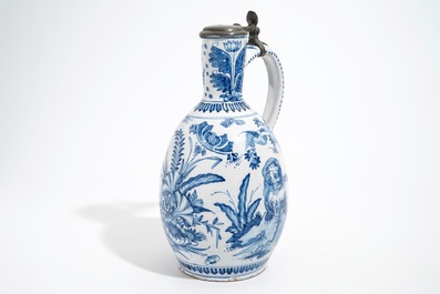 A large Dutch Delft blue and white jug with a tiger and a lion, 17th C.