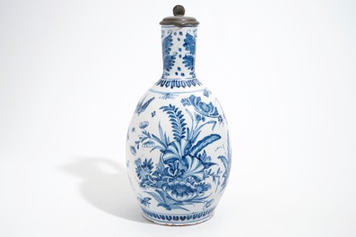 A large Dutch Delft blue and white jug with a tiger and a lion, 17th C.