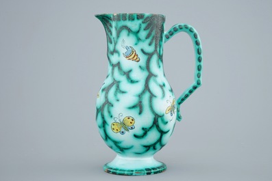 A Brussels faience water jug with butterflies and caterpillars, 18/19th C.