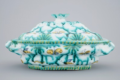 A Brussels faience tureen and cover with butterflies and caterpillars, 18th C.