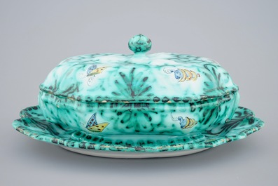 A Brussels faience tureen and cover on stand with butterflies and caterpillars, 18th C.