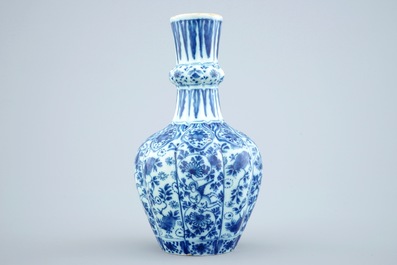 A Dutch Delft blue and white vase and a polychrome dish, 18th C.