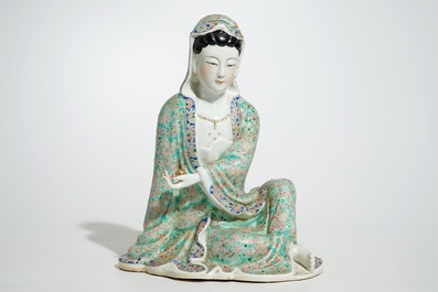 A Chinese famille rose model of a seated Guanyin, 19th C.