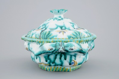 A Brussels faience tureen and cover with butterflies and caterpillars, 18th C.