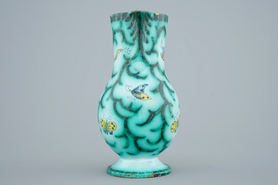 A Brussels faience water jug with butterflies and caterpillars, 18/19th C.