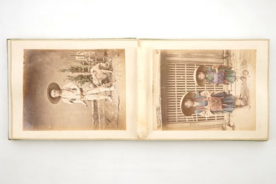A Japanese photo album with 50 polychrome albumine photos, in original box, 19th C.