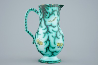 A Brussels faience water jug with butterflies and caterpillars, 18/19th C.