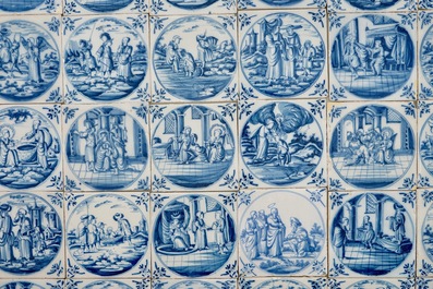 Un lot de 36 carreaux religieux en fa&iuml;ence de Delft bleu et blanc, 18&egrave;me