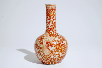 A Chinese iron red and gilt phoenix bottle vase, Guangxu, 19/20th C.