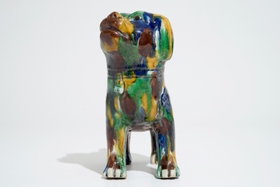 A Chinese spinach and egg glazed model of a dog on stand, 19th C.