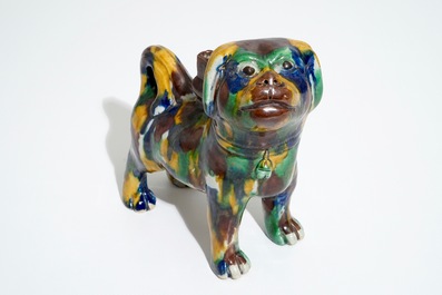 A Chinese spinach and egg glazed model of a dog on stand, 19th C.