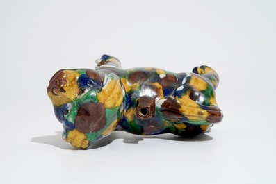 A Chinese spinach and egg glazed model of a dog on stand, 19th C.