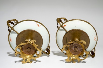 A pair of Chinese bronze-mounted famille rose plates with bats and peaches, Guangxu, 19/20th C.
