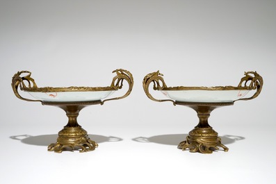A pair of Chinese bronze-mounted famille rose plates with bats and peaches, Guangxu, 19/20th C.