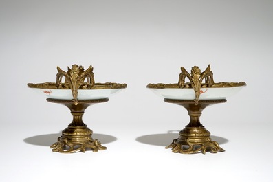 A pair of Chinese bronze-mounted famille rose plates with bats and peaches, Guangxu, 19/20th C.