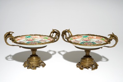 A pair of Chinese bronze-mounted famille rose plates with bats and peaches, Guangxu, 19/20th C.