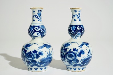 A pair of Dutch Delft blue and white double gourd vases, 1st quarter 18th C.