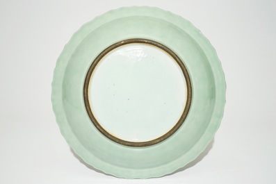 A Chinese monochrome celadon charger with underglaze floral design, Qianlong