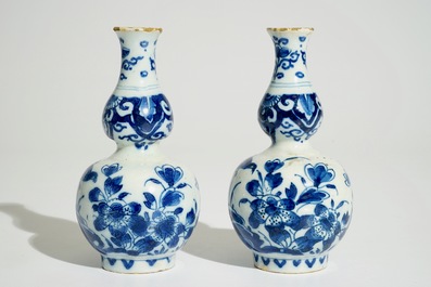A pair of Dutch Delft blue and white double gourd vases, 1st quarter 18th C.