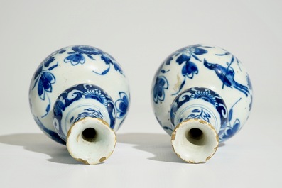 A pair of Dutch Delft blue and white double gourd vases, 1st quarter 18th C.