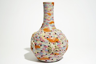 A Chinese famille rose reticulated bottle vase with figures, 19th C.
