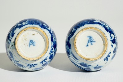 A pair of Dutch Delft blue and white double gourd vases, 1st quarter 18th C.