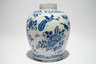 A Dutch Delft blue and white jar with putti design, 18th C.