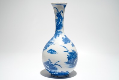 A Dutch Delft blue and white chinoiserie bottle vase, 17th C.