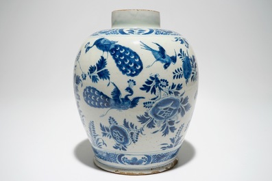 A Dutch Delft blue and white jar with putti design, 18th C.