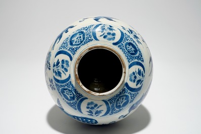 A Dutch Delft blue and white jar with putti design, 18th C.