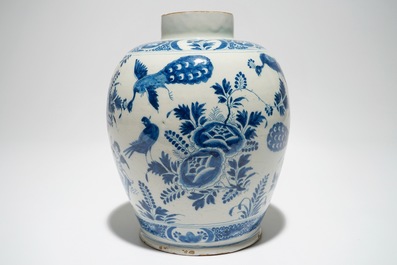A Dutch Delft blue and white jar with putti design, 18th C.
