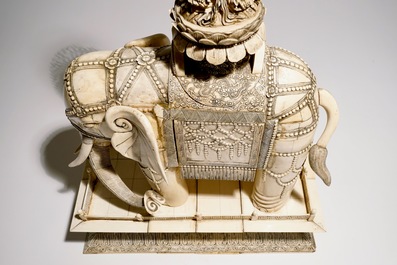 A pair of massive ivory groups of Guanyin seated on an elephants, 19th C.
