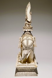 A pair of massive ivory groups of Guanyin seated on an elephants, 19th C.