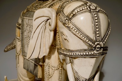 A pair of massive ivory groups of Guanyin seated on an elephants, 19th C.