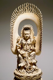 A pair of massive ivory groups of Guanyin seated on an elephants, 19th C.